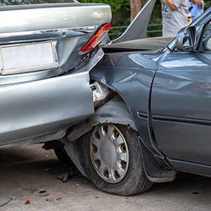 Rear-end car accident on a street; insurance claims and legal evidence for vehicle collisions.